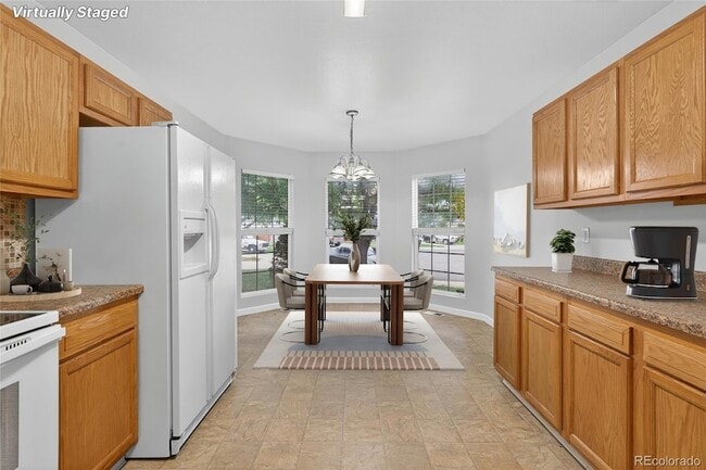 5241 Helena St, Unit 3-E-204 in Denver, CO - Building Photo - Building Photo