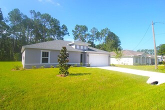 32 Postman Ln in Palm Coast, FL - Foto de edificio - Building Photo