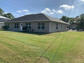 1897 SW Lofgren Ave in Port St. Lucie, FL - Building Photo - Building Photo