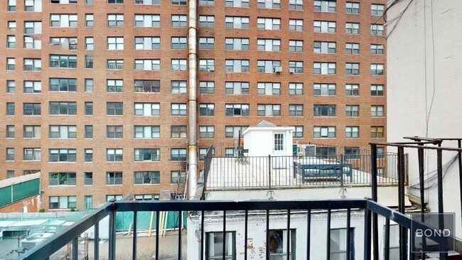 property at 213 E 26th St