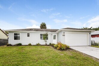 1874 Delki St NW in Palm Bay, FL - Foto de edificio - Building Photo