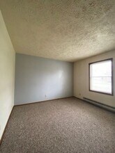 208 S Spring St, Unit APT. A in Wakarusa, IN - Building Photo - Building Photo