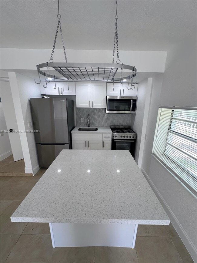 property at 9064 Collins Ave