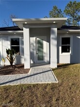 1037 Macy St E in Lehigh Acres, FL - Building Photo - Building Photo