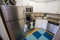Our updated kitchens feature brand new cabinets, countertops and stainless steel appliances. - The Laurels Apartment Homes in Ft. Myers, Florida