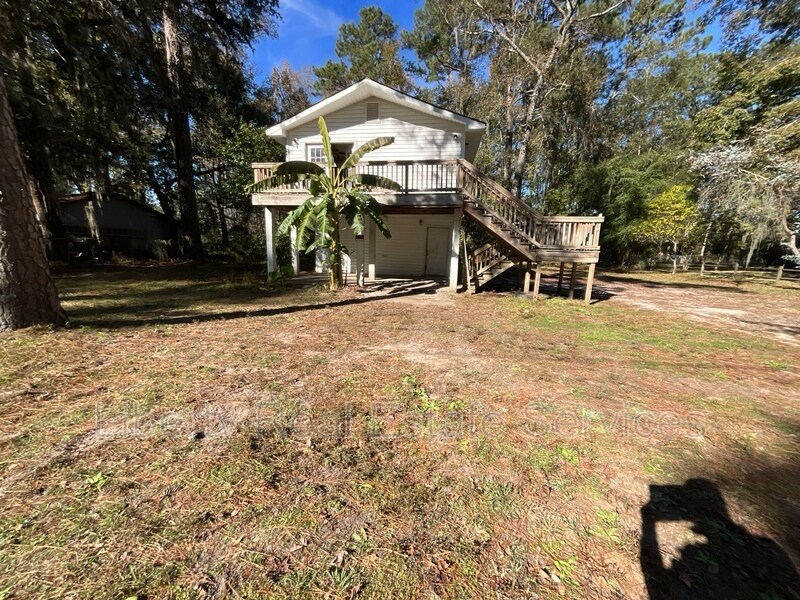 153 Wild Heron Dr in Midway, GA - Foto de edificio