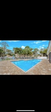1018 Woodshire Ln, Unit A208 in Naples, FL - Building Photo - Building Photo