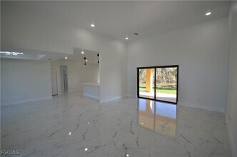 1242 Hathor St E, Unit 31-421 in Lehigh Acres, FL - Building Photo - Building Photo