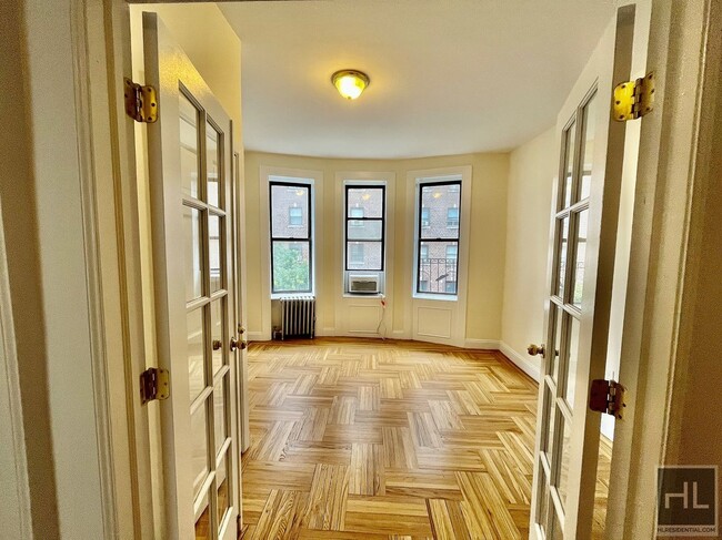 229-231-231 E 12th St