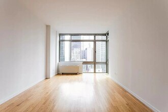 2 Maiden Ln, Unit 3407 in New York, NY - Foto de edificio - Building Photo
