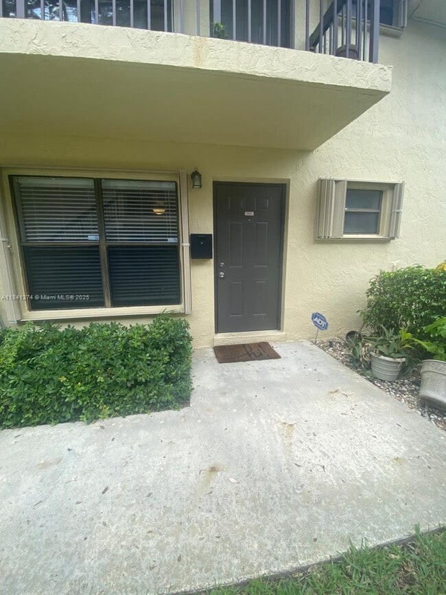 property at 10055 NW 4th St