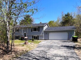 10279 Woodwind Dr in Interlochen, MI - Building Photo