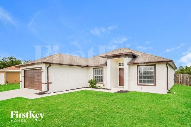 6008 Flora Ave N in Lehigh Acres, FL - Building Photo - Building Photo