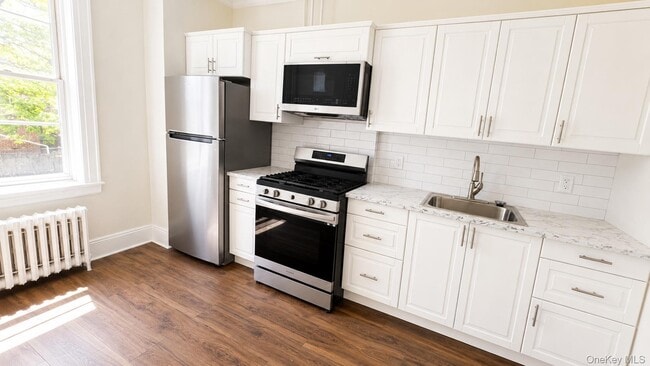 property at 65-04 Grand Ave