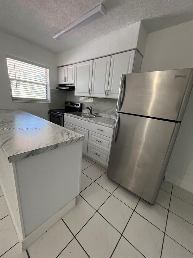 property at 7155 W 14th Ct