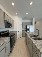 7627 WATERSCAPE Dr in Groveland, FL - Building Photo - Building Photo