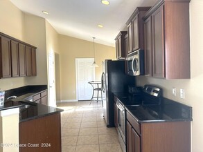 1279 Corbett Ln, Unit 4S-F in Melbourne, FL - Building Photo - Building Photo