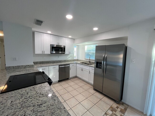 1057 Tropical Ave NW in Port Charlotte, FL - Building Photo - Building Photo