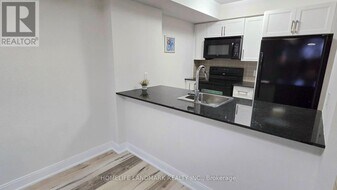 125-1125 Village Green Square in Toronto, ON - Building Photo