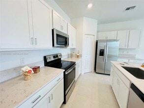 6909 Harbours Edge Ave in Greenacres, FL - Building Photo - Building Photo