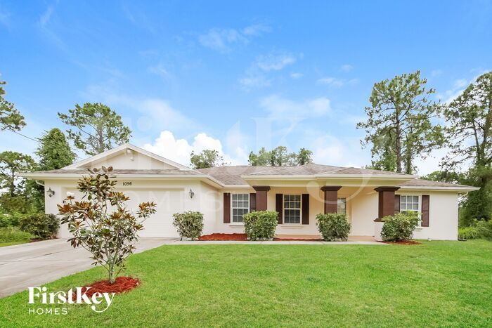 1056 Merry St E in Lehigh Acres, FL - Building Photo