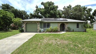 1358 Song St in Port Charlotte, FL - Building Photo