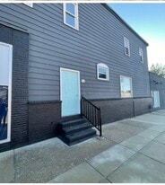 702 S Washington Ave, Unit 3 in Ludington, MI - Building Photo