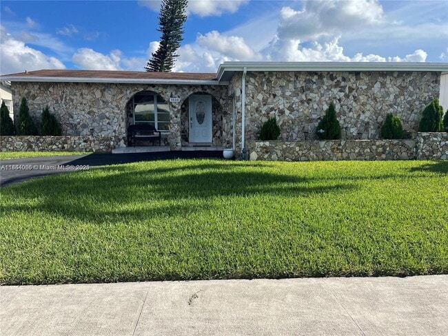 property at 9590 NW 24th Pl