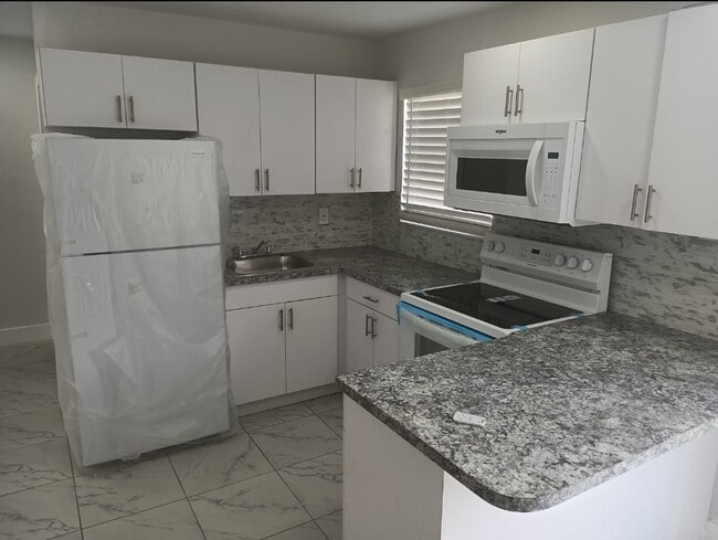 property at 1590 NW 123rd St
