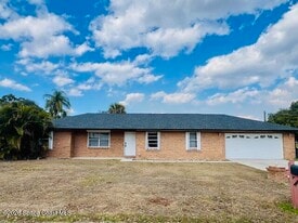 7746 Mango Grove Ave in Melbourne, FL - Building Photo
