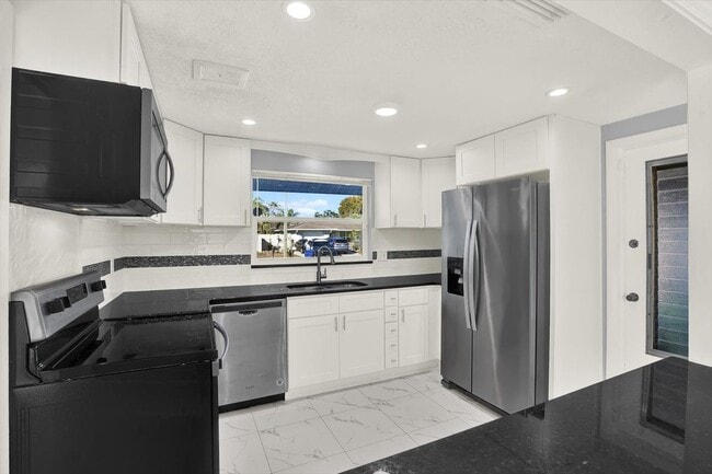 property at 7902 Canna Dr