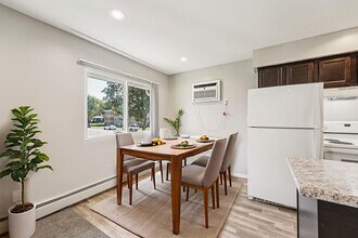 Village Manor Apartments in North St. Paul, MN - Building Photo - Building Photo