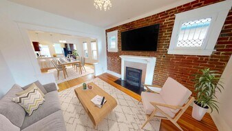 Recently updated Jefferson Park home with fenced backyard in Denver, CO - Building Photo