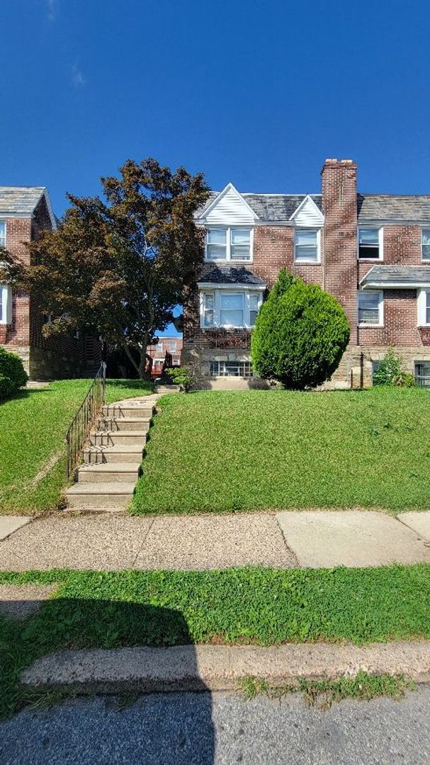 property at 7703 Woolston Ave