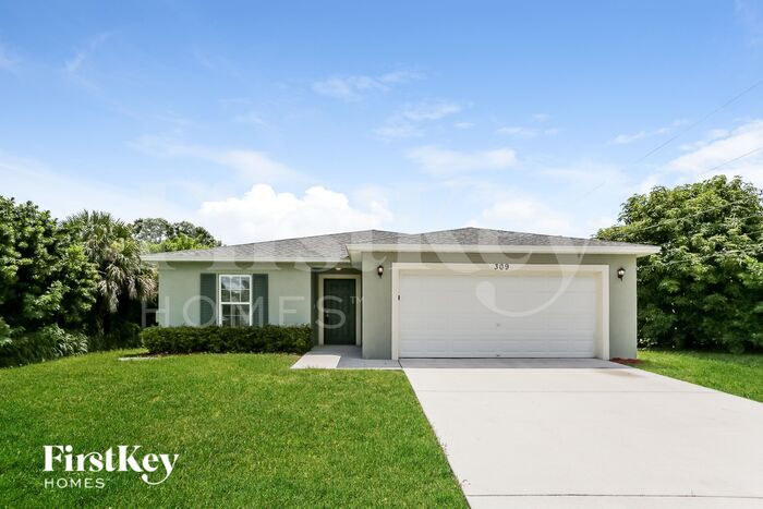 309 NW Granadeer St in Port St. Lucie, FL - Building Photo