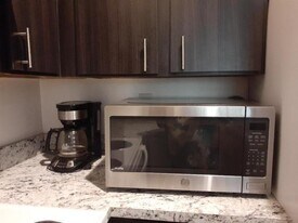 911 Lyons Rd in Coconut Creek, FL - Building Photo