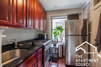 544 W Surf St, Unit E1 in Chicago, IL - Building Photo - Building Photo