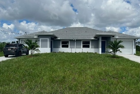 122 Harry Ave S in Lehigh Acres, FL - Building Photo