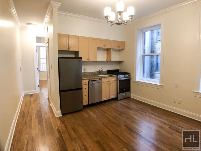 207-209-209 W 11th St