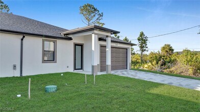 704 Homer Ave S in Lehigh Acres, FL - Building Photo - Building Photo