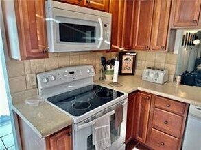 215 Palm Dr-Unit -1 in Naples, FL - Foto de edificio - Building Photo