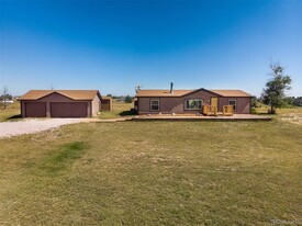 5695 Peerless Farms Rd in Peyton, CO - Building Photo