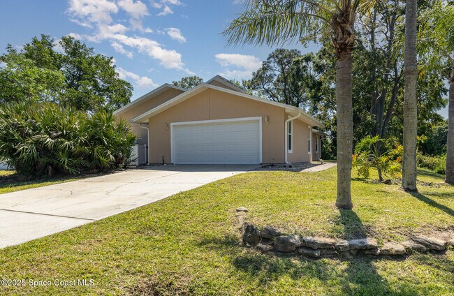 1399 Tilberg Ave NW in Palm Bay, FL - Building Photo - Building Photo