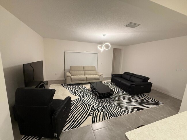 1239 Sand Torch Cir in Davenport, FL - Foto de edificio - Building Photo