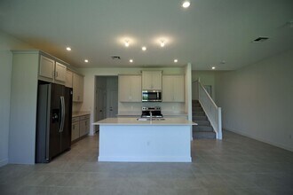 14050 SW Thorens Dr in Port St. Lucie, FL - Building Photo - Building Photo