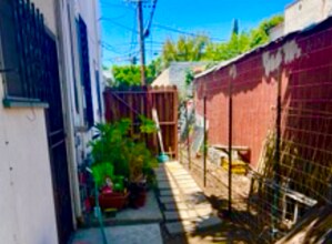 6089 1/4 Cashio St in Los Angeles, CA - Building Photo - Building Photo