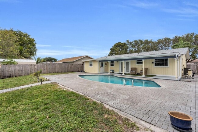 property at 9860 NW 3rd St