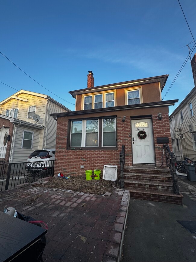 property at 109-11-111 205th St