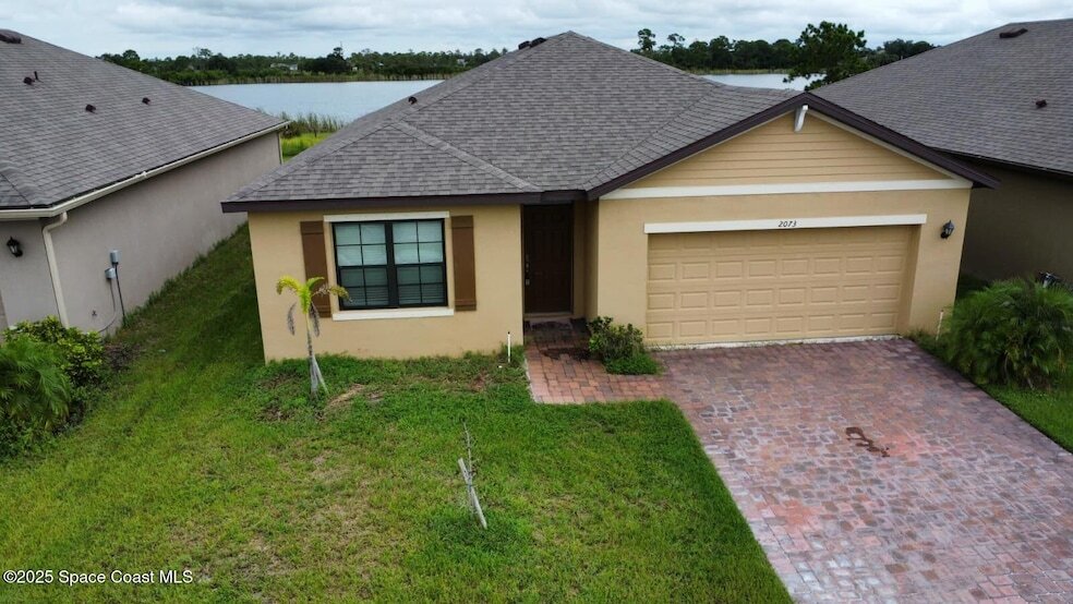 2073 Farmhouse Rd SE, Unit 5 in Palm Bay, FL - Building Photo
