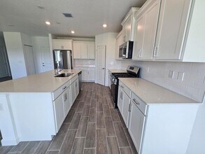 19672 WHISPERING CREEK Rd in The Acreage, FL - Building Photo - Building Photo